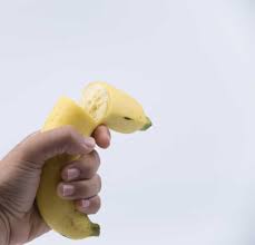 Hand holding banana